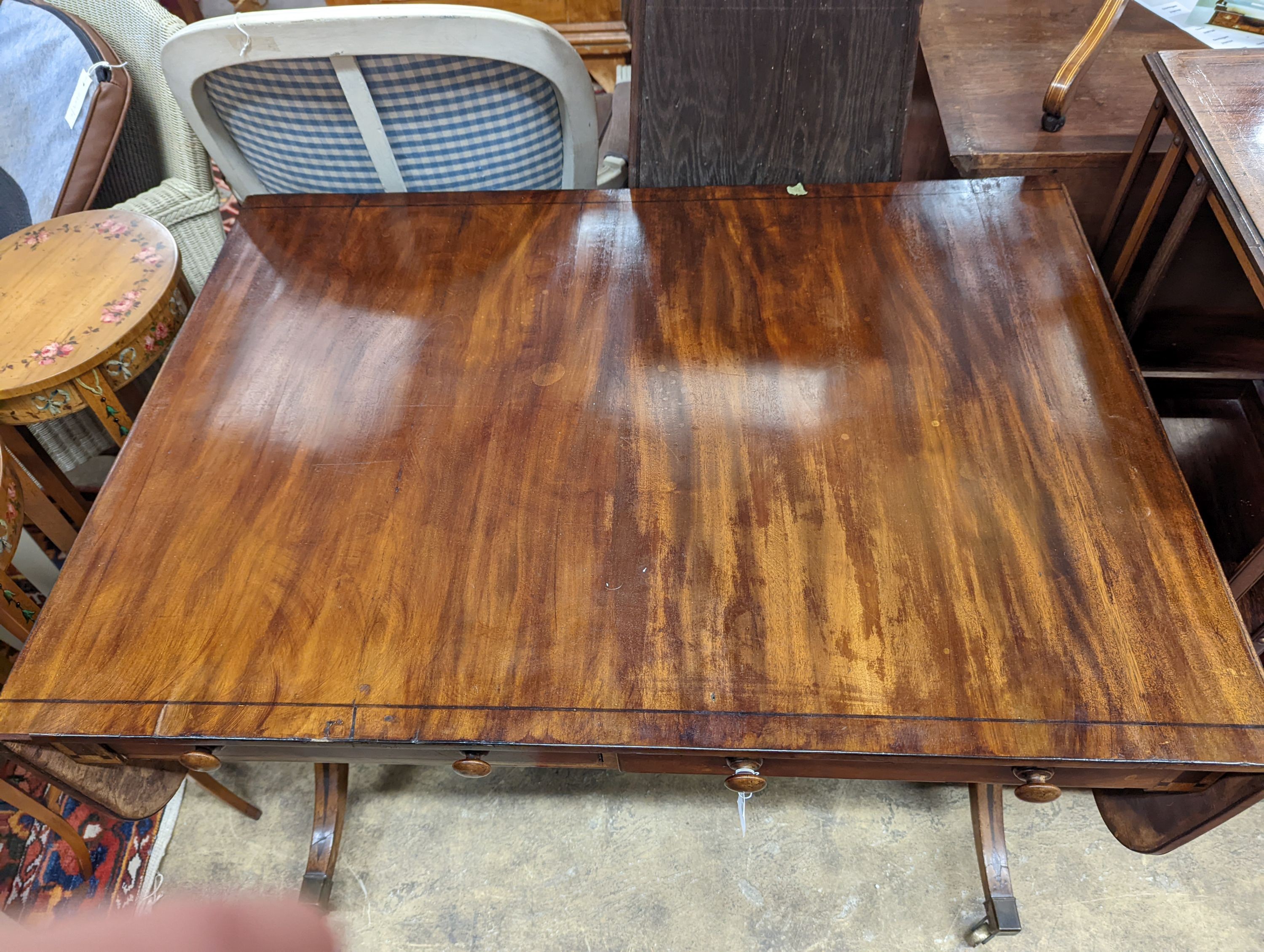 A Regency ebony inlaid mahogany sofa table, width 98cm, depth 69cm, height 72cm